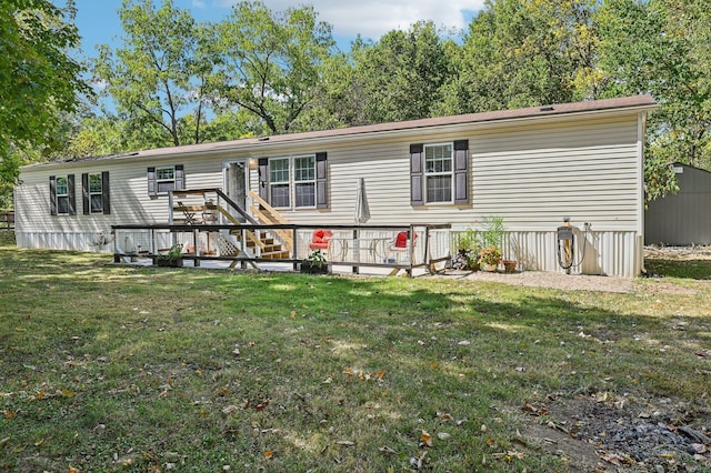 view of front of house with a front lawn and a deck