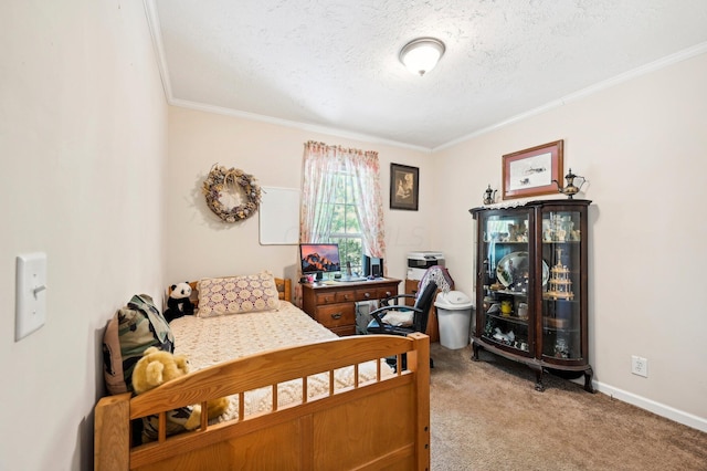 carpeted bedroom featuring ornamental molding and a textured ceiling