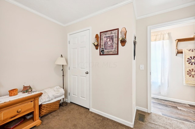 bedroom featuring hardwood / wood-style floors and ornamental molding