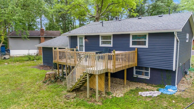 back of house with a lawn and a wooden deck