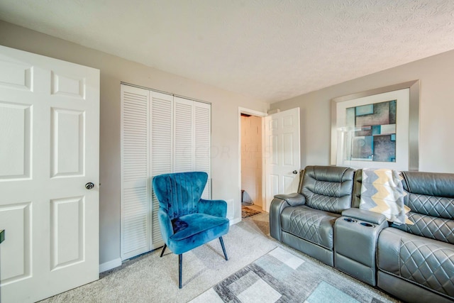 living room with light colored carpet and a textured ceiling