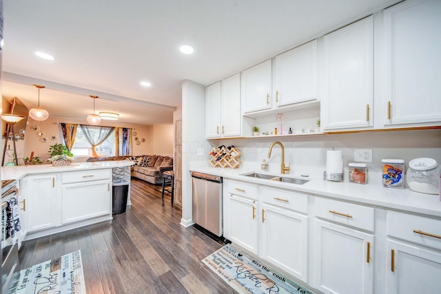 kitchen with white cabinets, dishwasher, sink, and decorative light fixtures