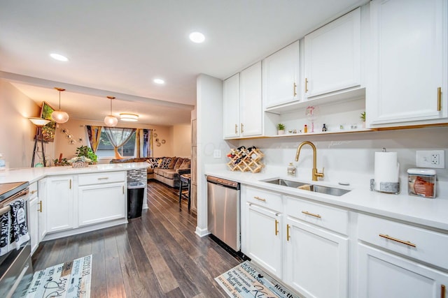 kitchen with dishwasher, dark wood-type flooring, white cabinets, sink, and decorative light fixtures