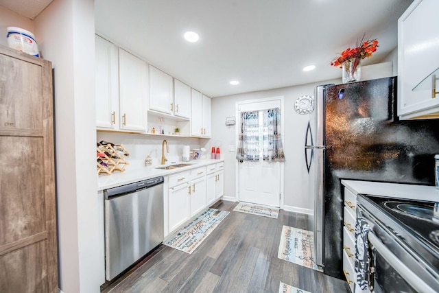 kitchen featuring appliances with stainless steel finishes, white cabinetry, and dark wood-type flooring