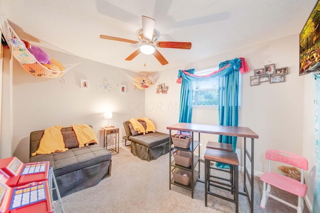 interior space with carpet and ceiling fan