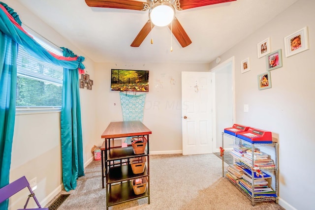 game room with carpet flooring and ceiling fan