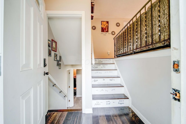 stairs with hardwood / wood-style flooring