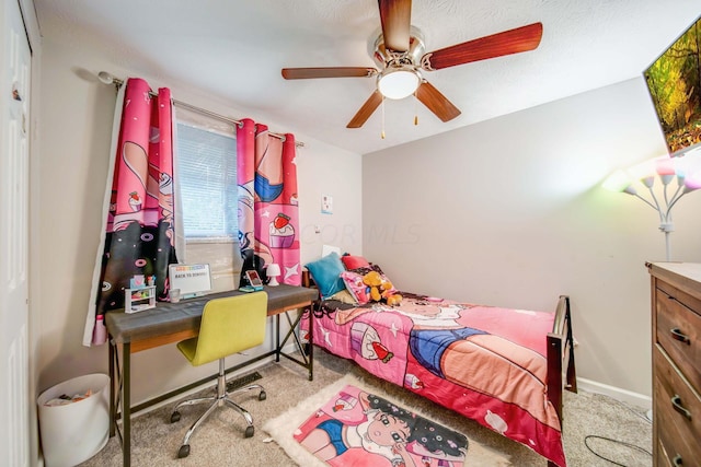 carpeted bedroom featuring ceiling fan