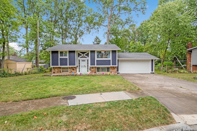 bi-level home with a garage and a front lawn