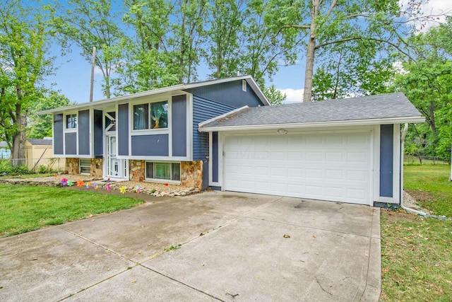 view of front facade with a garage and a front lawn