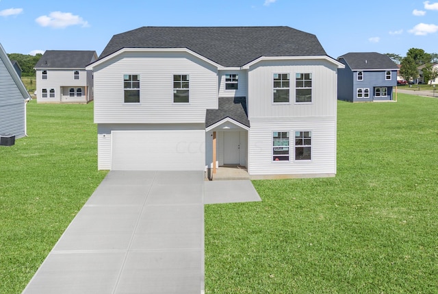 view of front facade with a front yard and a garage