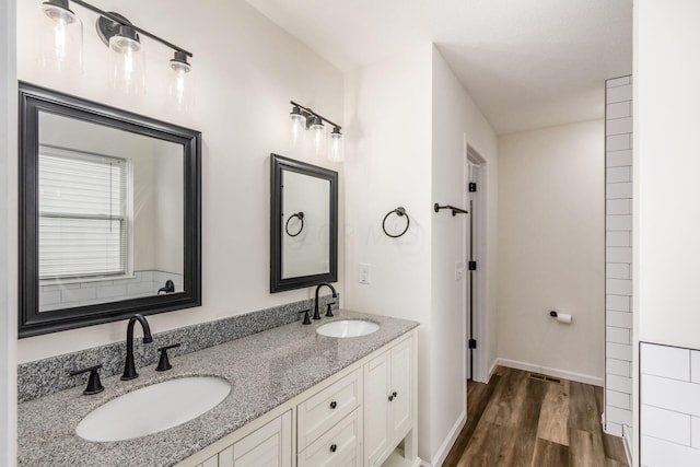 bathroom featuring hardwood / wood-style floors and vanity