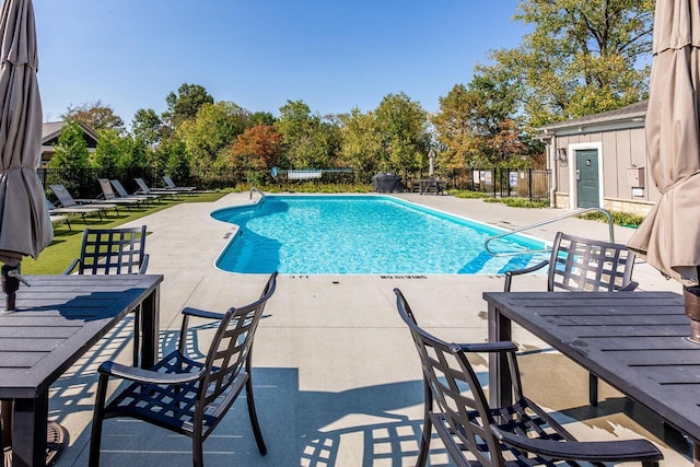 view of swimming pool with a patio area