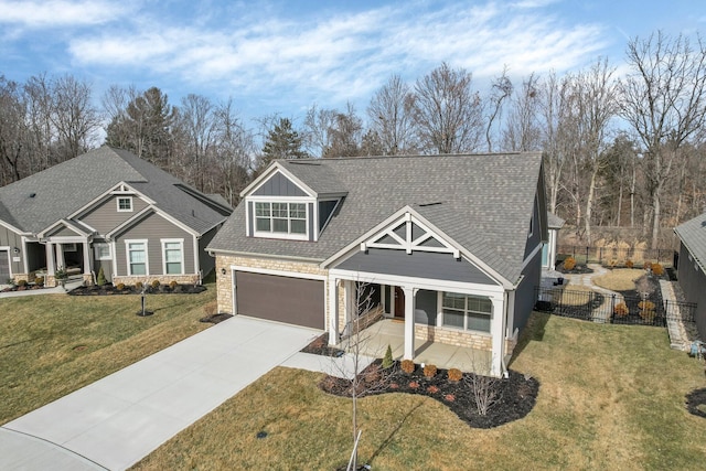 craftsman-style home with a front yard and covered porch