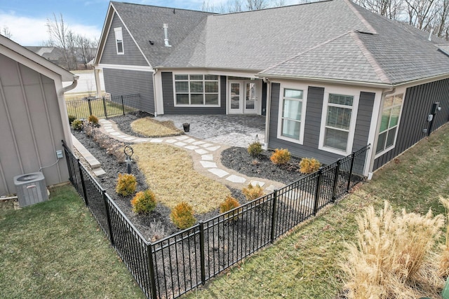 rear view of house with a yard