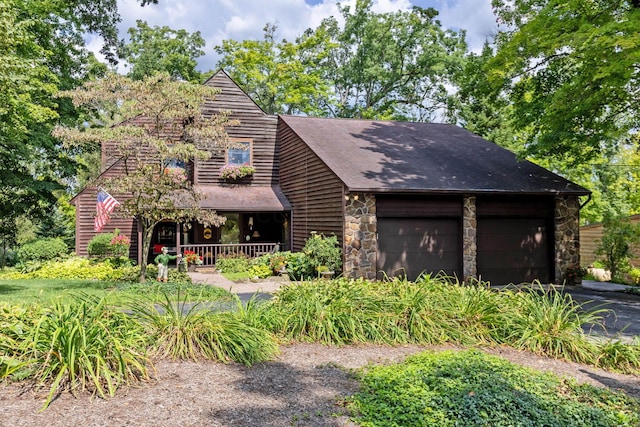 view of front of home with covered porch and a garage