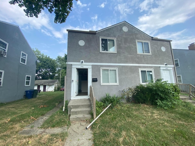 view of front of home with a front lawn