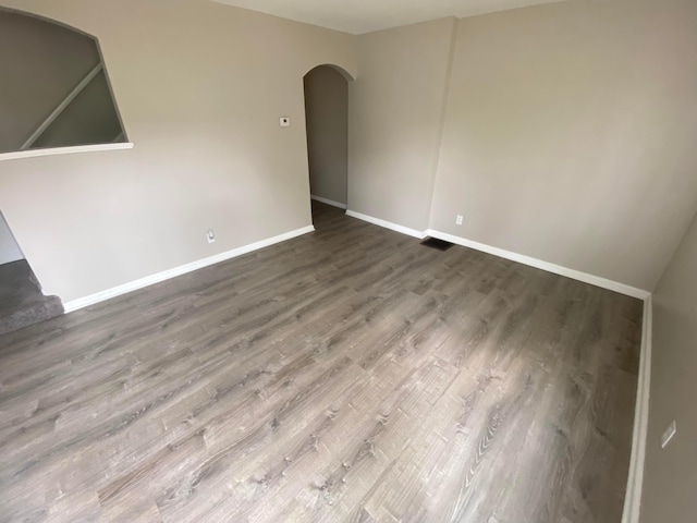 spare room with hardwood / wood-style flooring