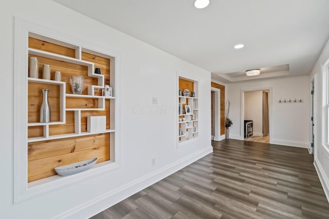 corridor featuring dark hardwood / wood-style floors