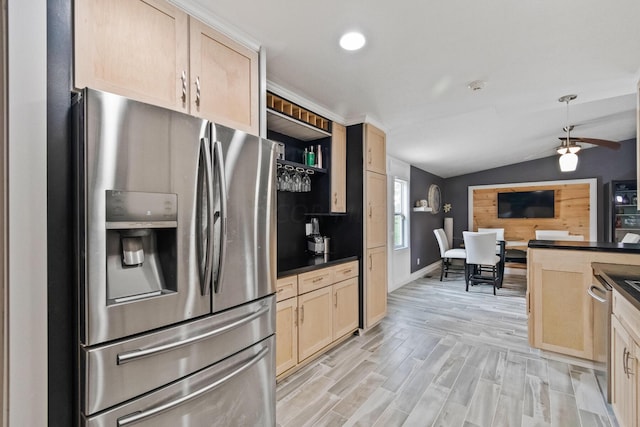 kitchen with stainless steel refrigerator with ice dispenser, light wood-type flooring, vaulted ceiling, and light brown cabinetry