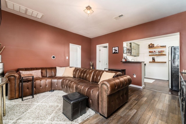 living room featuring dark wood-type flooring