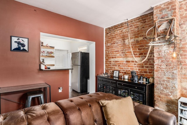 living room featuring brick wall