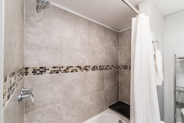 bathroom featuring shower / bathtub combination with curtain