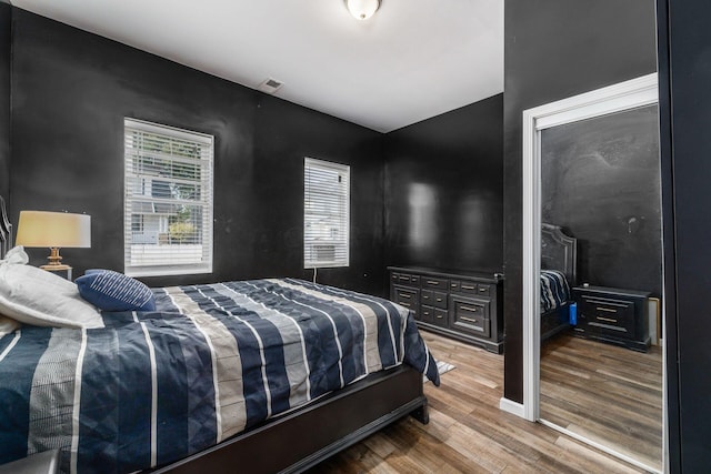 bedroom with wood-type flooring