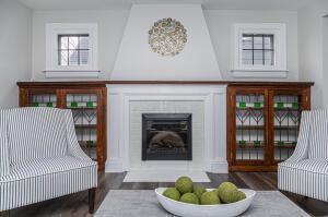 sitting room featuring a large fireplace and dark wood-type flooring