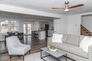 living room with french doors, dark hardwood / wood-style floors, and ceiling fan