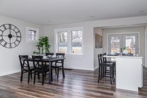 dining space featuring dark hardwood / wood-style flooring, plenty of natural light, and french doors