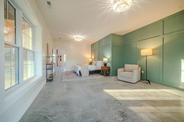 bedroom featuring an inviting chandelier