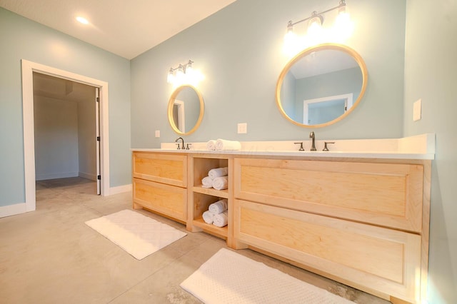 bathroom featuring vanity and concrete floors