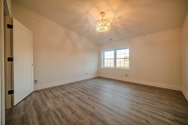 spare room featuring dark hardwood / wood-style flooring