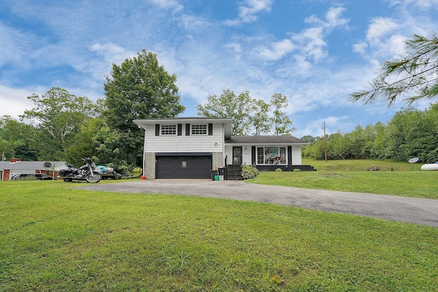 tri-level home with a front yard and a garage