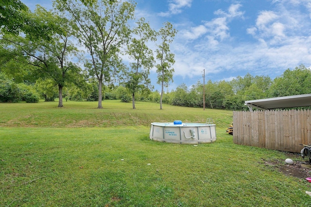 view of yard featuring a fenced in pool