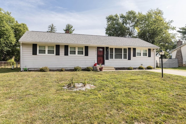 ranch-style house featuring a front lawn