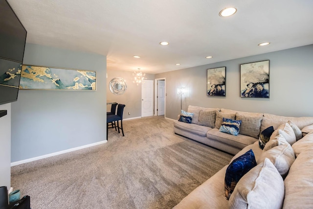 living room with carpet and a chandelier