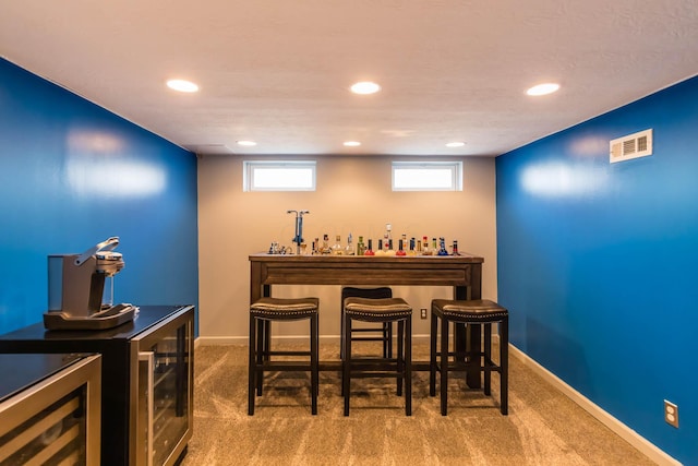 bar with carpet flooring and wine cooler