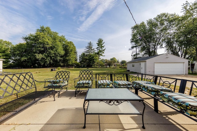 view of patio with a garage and an outdoor structure