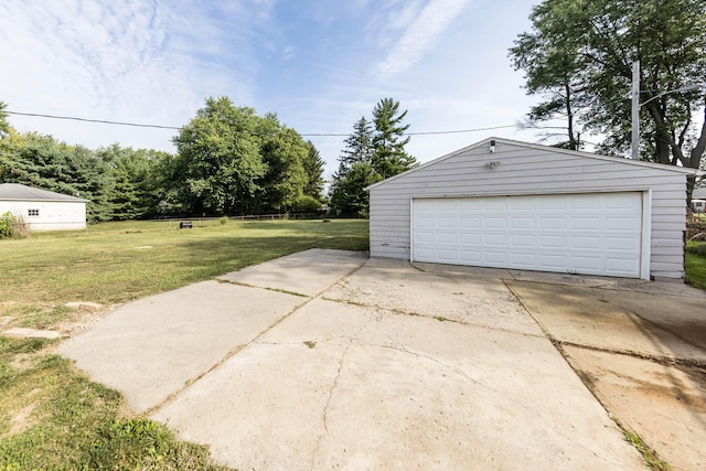 garage featuring a lawn