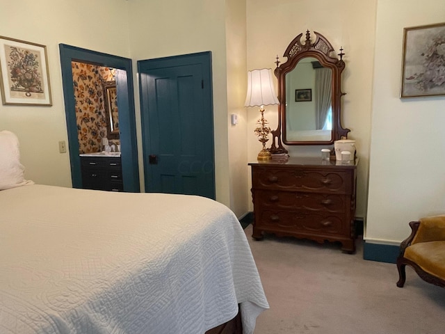 bedroom with light colored carpet