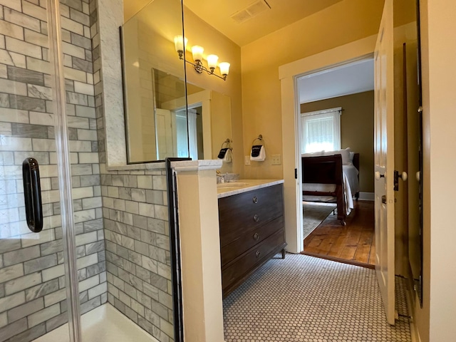 bathroom featuring vanity, wood-type flooring, and walk in shower