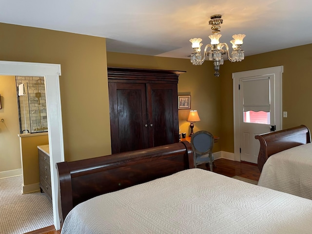 bedroom with a chandelier and wood-type flooring