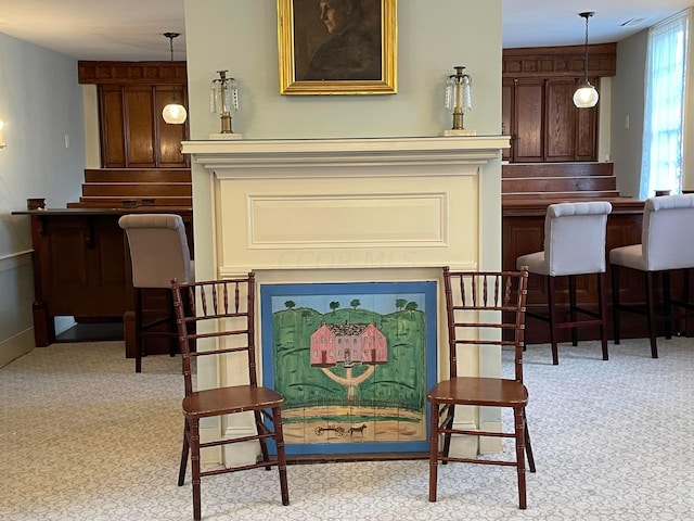 sitting room with light colored carpet