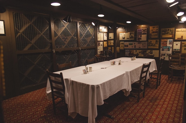 wine area with dark colored carpet