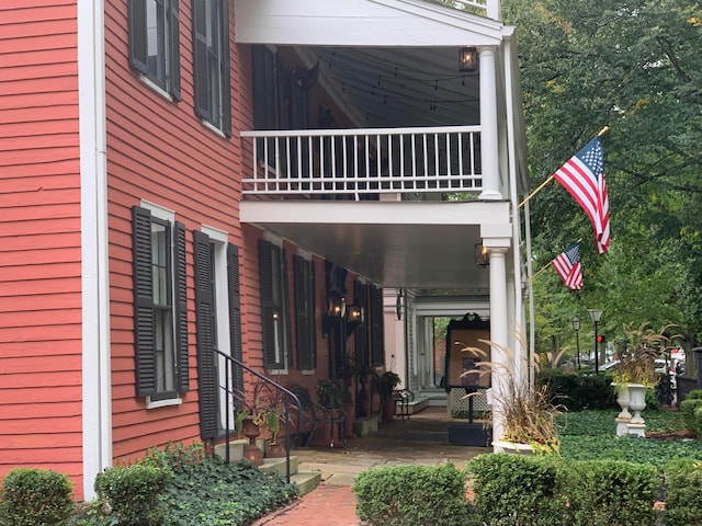 view of side of home with a balcony