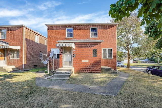 view of property featuring a front lawn