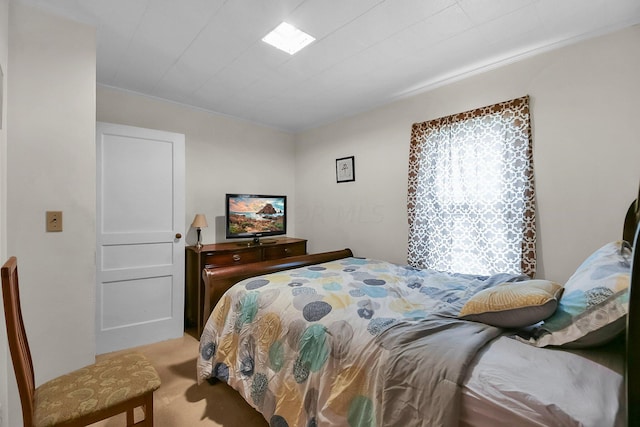 bedroom featuring light carpet