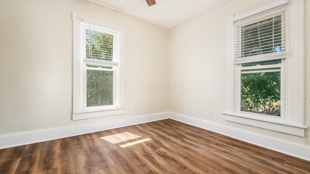 spare room with hardwood / wood-style flooring and ceiling fan